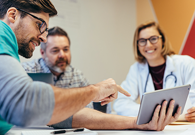 Employees collaborating in a skills workshop, building capabilities together for growth.